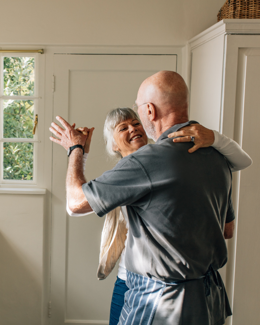 Senior man and woman dancing